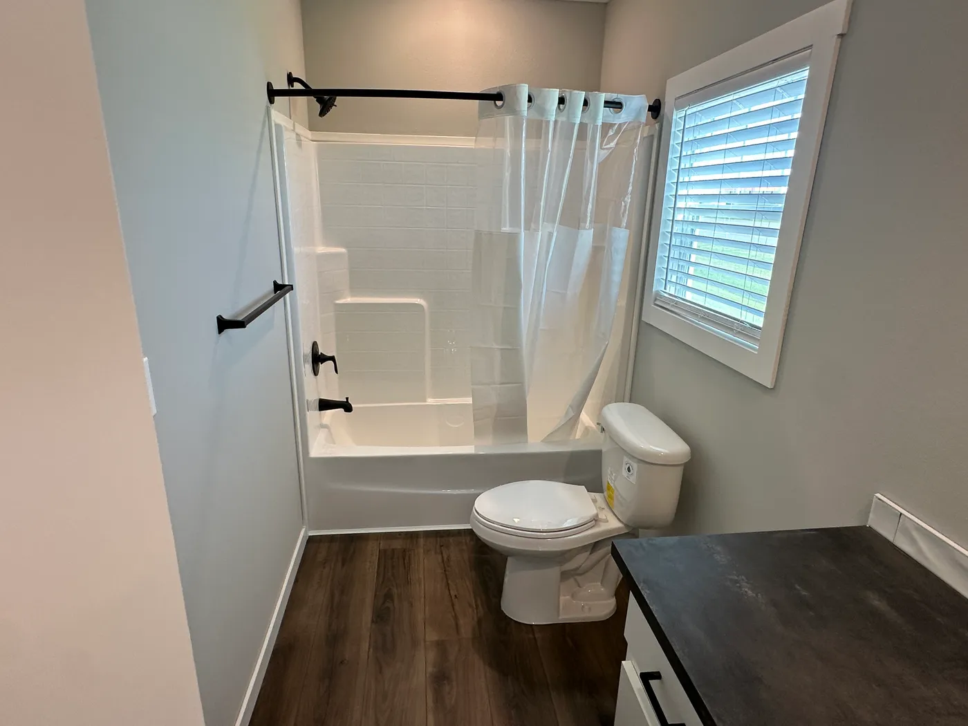 Step inside one of the most beautiful 4 bedroom, 3 bathroom tape and textured doublewide manufactured homes on the market. This stunning home is designed with upscale finishes, open living space, and modern comfort throughout. The spacious living room features vaulted ceilings, elegant crown moulding, and a built-in fireplace that creates a warm, high-end feel the moment you walk in.

The kitchen is loaded with premium features, including quartz countertops, stainless steel appliances, and a s
