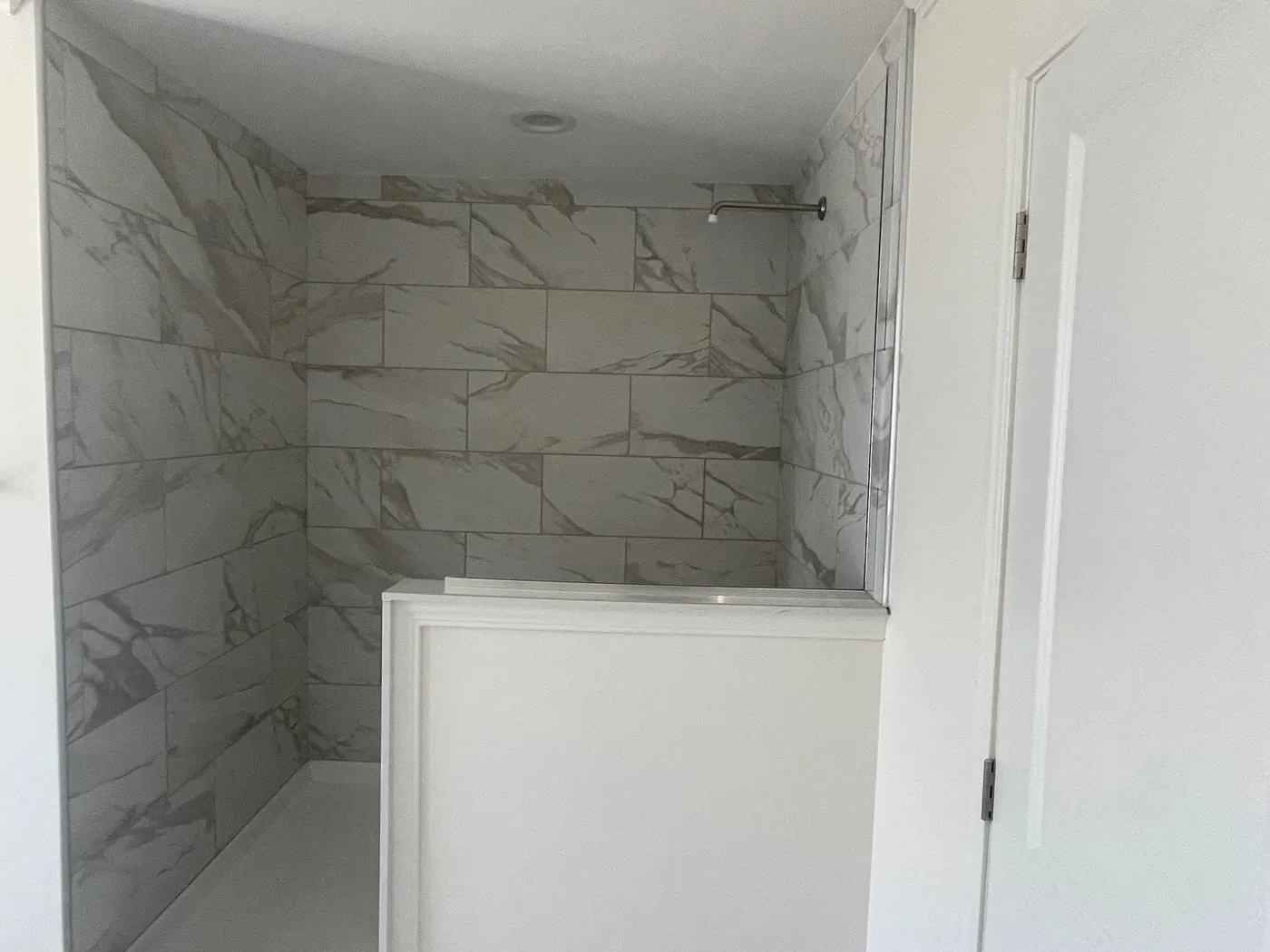 Enormous Master Shower with hand laid tile