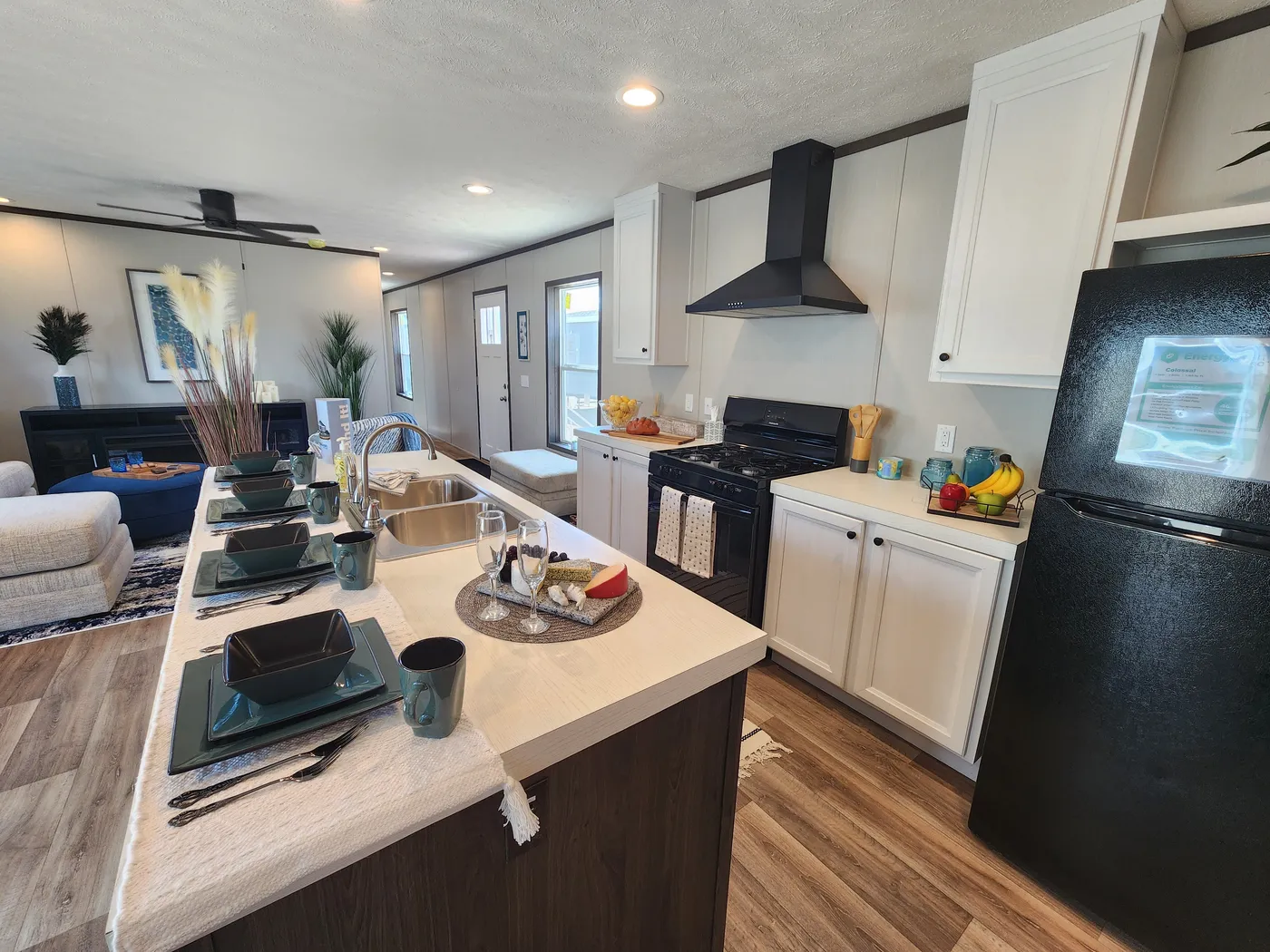 Large island with a steal farmhouse sink and lots of cabinet space in the island