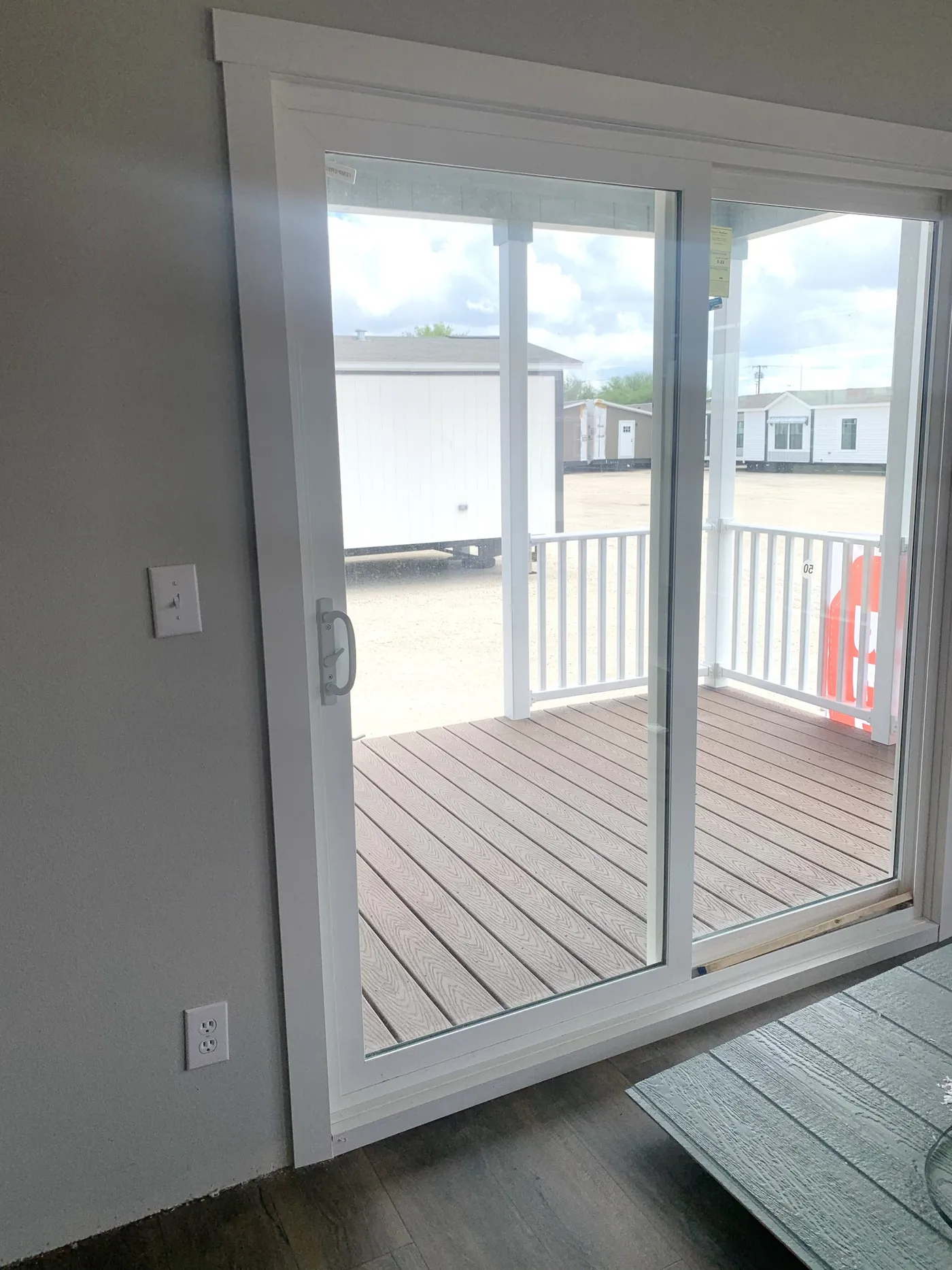 Doorwall leading to a gorgeous covered porch, all while providing natural light to compliment the open Dining area! 