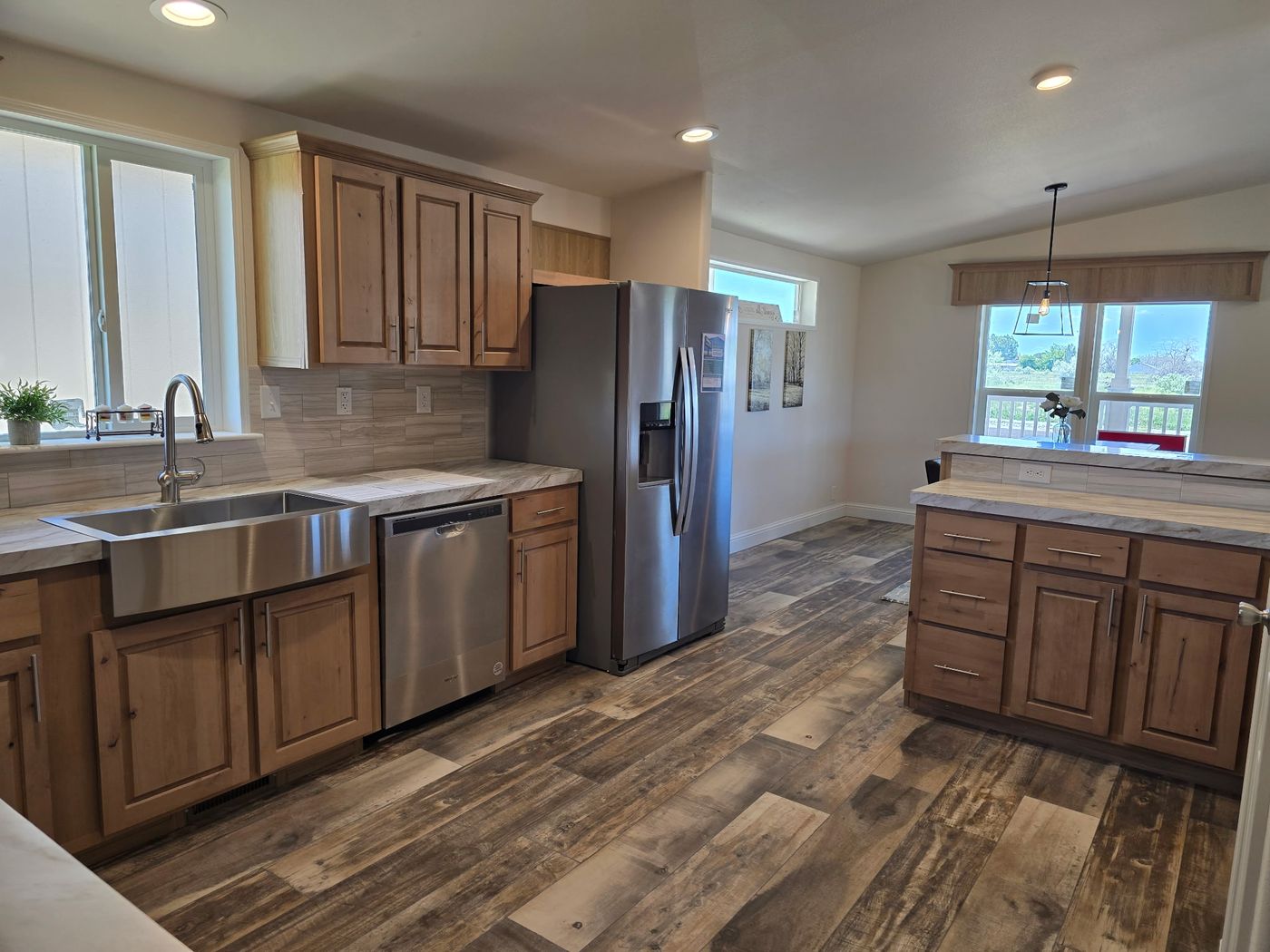 Experience a large, open-space kitchen thoughtfully designed to be both functional and inviting. The spacious layout offers ample room for cooking, dining, and gathering, making it the heart of the home. Open sightlines create a bright, airy atmosphere while allowing effortless connection to adjacent living and dining areas. With generous counter space, abundant cabinetry, and flexibility for an island or breakfast seating, this kitchen is ideal for everything from casual mornings to entertainin