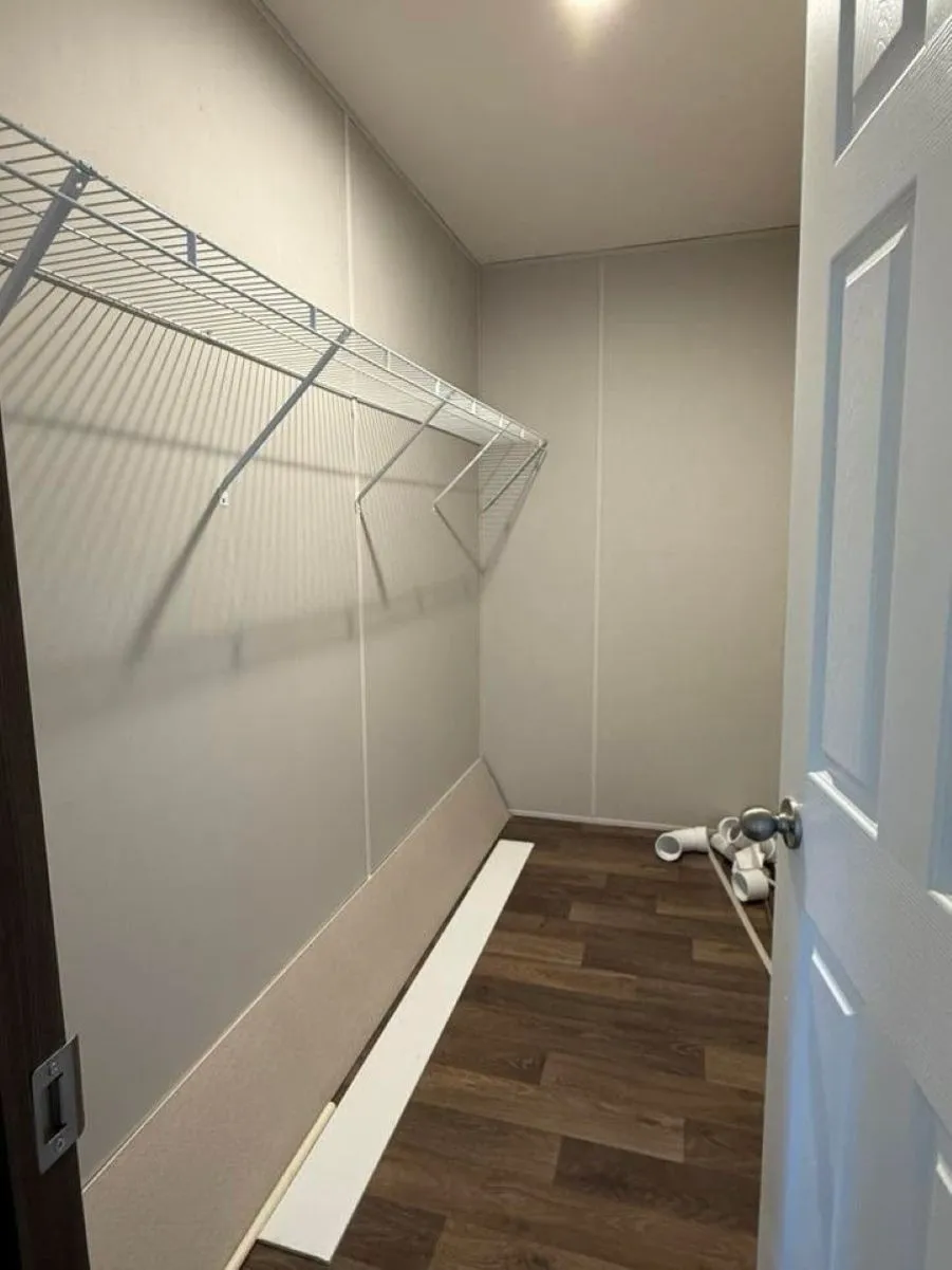 Walk-in closet in primary bedroom