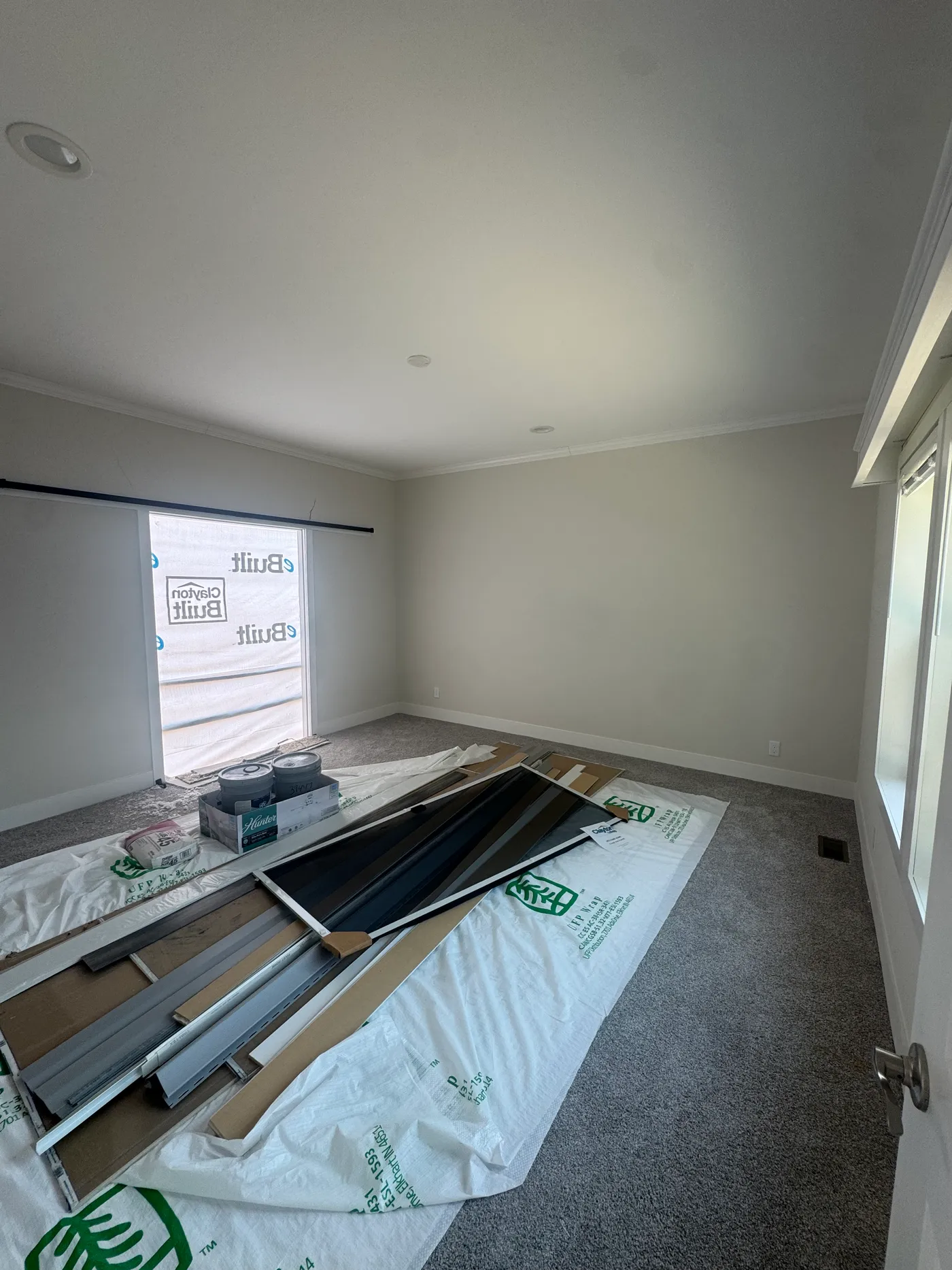 Primary Bed with sliding barn door entrance to Primary Bath. 