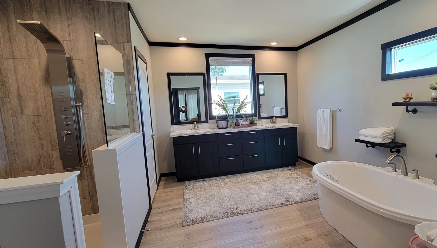 Luxury Master Bath Free Standing Soaker Tub and Body Blaster Shower Tower in the large tiled shower.
