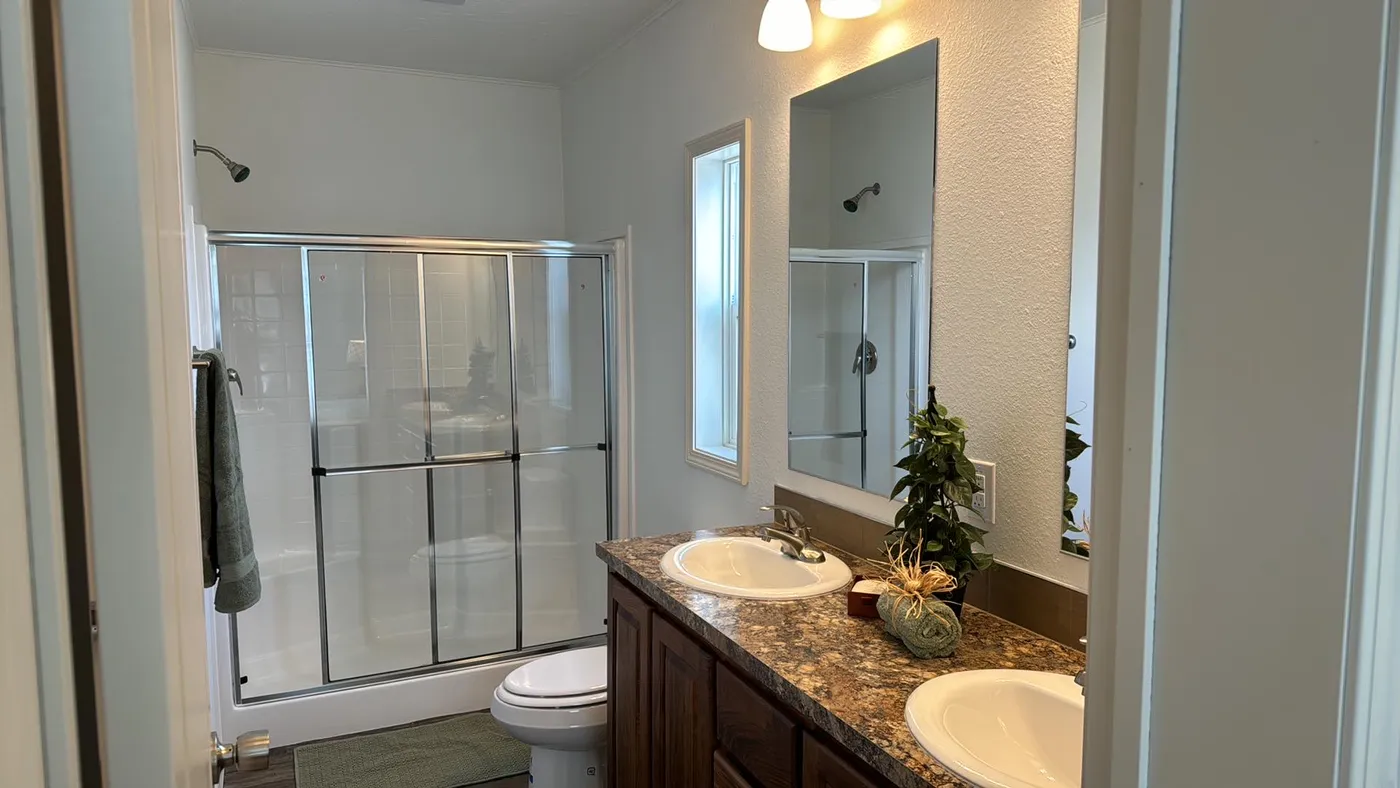 Walk in shower and dual china sink vanity.