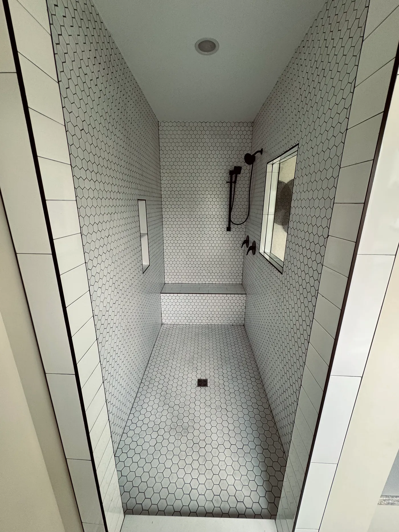 Hand Laid tile shower. 2 shower faucets.
