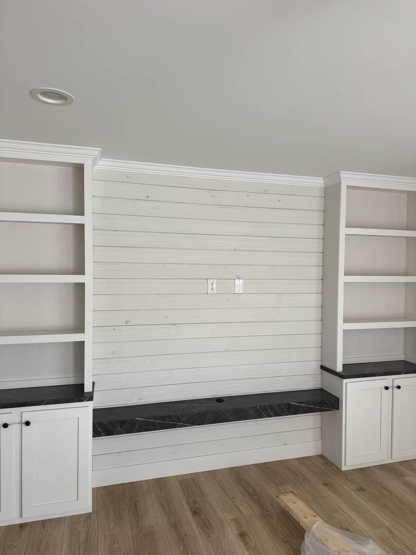 Living room shiplap entertainment center and build in cabinetry. 