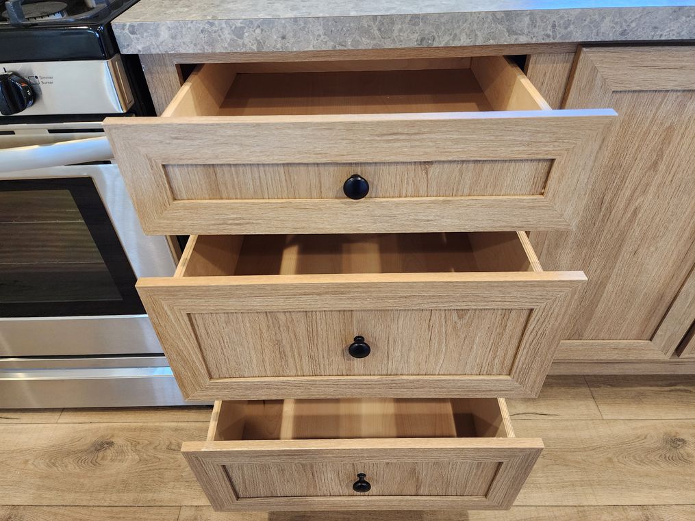 Bank of drawers to the left of the sink.
