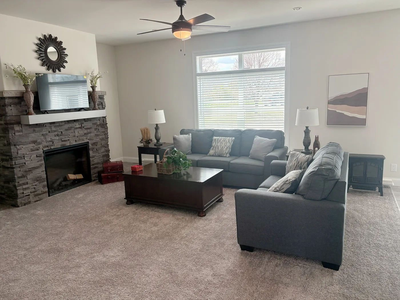 This spacious home includes 9 ft ceilings, a cozy fireplace and transom windows!