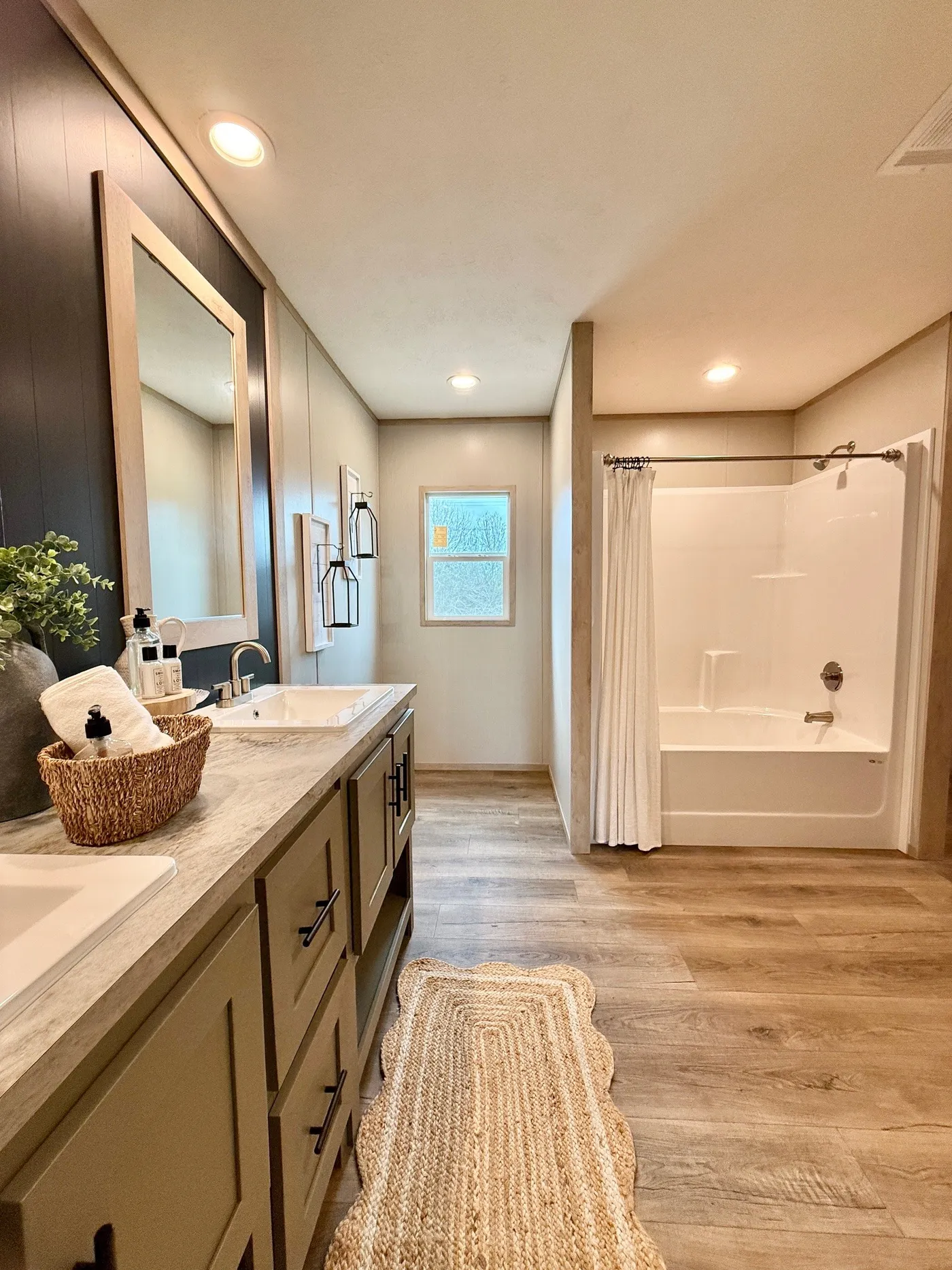 A bathroom designed for comfort and space.
The primary bathroom in this home feels like your own personal spa with double vanities, plenty of counter space, and a relaxing soaking tub with separate shower.
The layout gives you room to get ready without feeling crowded, while the modern finishes and natural light create a calm, peaceful atmosphere.
It’s the perfect place to start your morning or unwind after a long day.