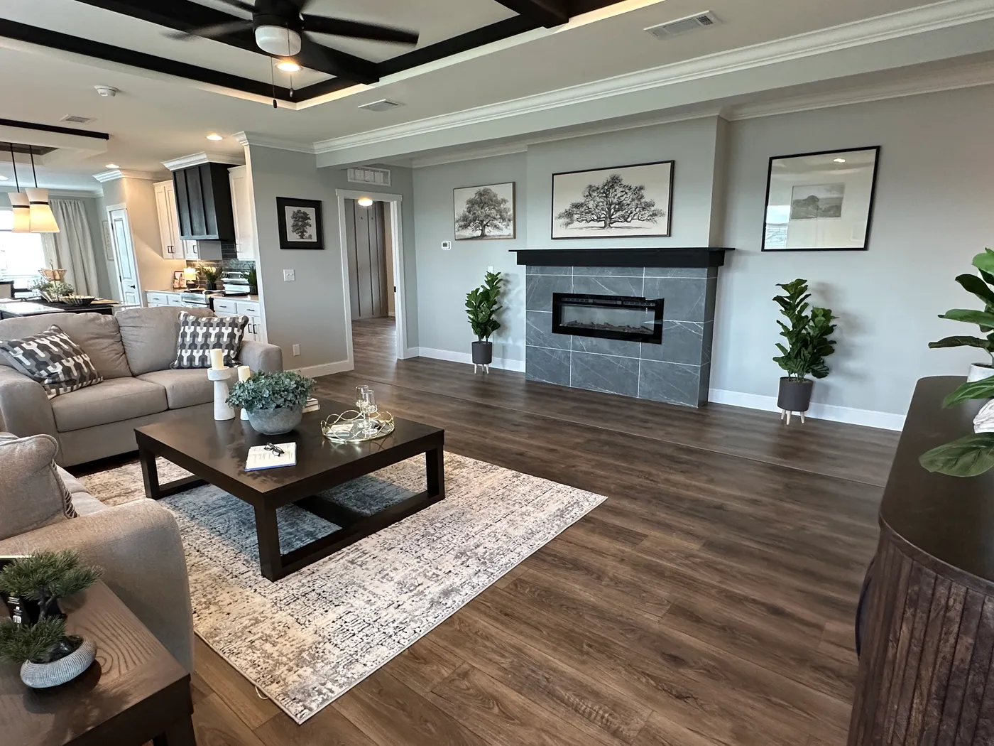 Step inside one of the most beautiful 4 bedroom, 3 bathroom tape and textured doublewide manufactured homes on the market. This stunning home is designed with upscale finishes, open living space, and modern comfort throughout. The spacious living room features vaulted ceilings, elegant crown moulding, and a built-in fireplace that creates a warm, high-end feel the moment you walk in.

The kitchen is loaded with premium features, including quartz countertops, stainless steel appliances, and a s