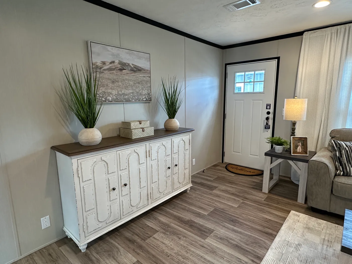 Discover The Heritage, a beautiful 3-bedroom, 2-bath manufactured home offering 1,568 square feet of spacious, functional living at Clayton Homes of Alvin, Texas! This stunning home features a spacious open-concept living room, a modern kitchen with an oversized multifunctional island, and a beautiful built-in fireplace. Enjoy a thoughtfully designed private split-bedroom floor plan, offering comfort and separation for the entire family. The oversized utility and laundry room features a convenie