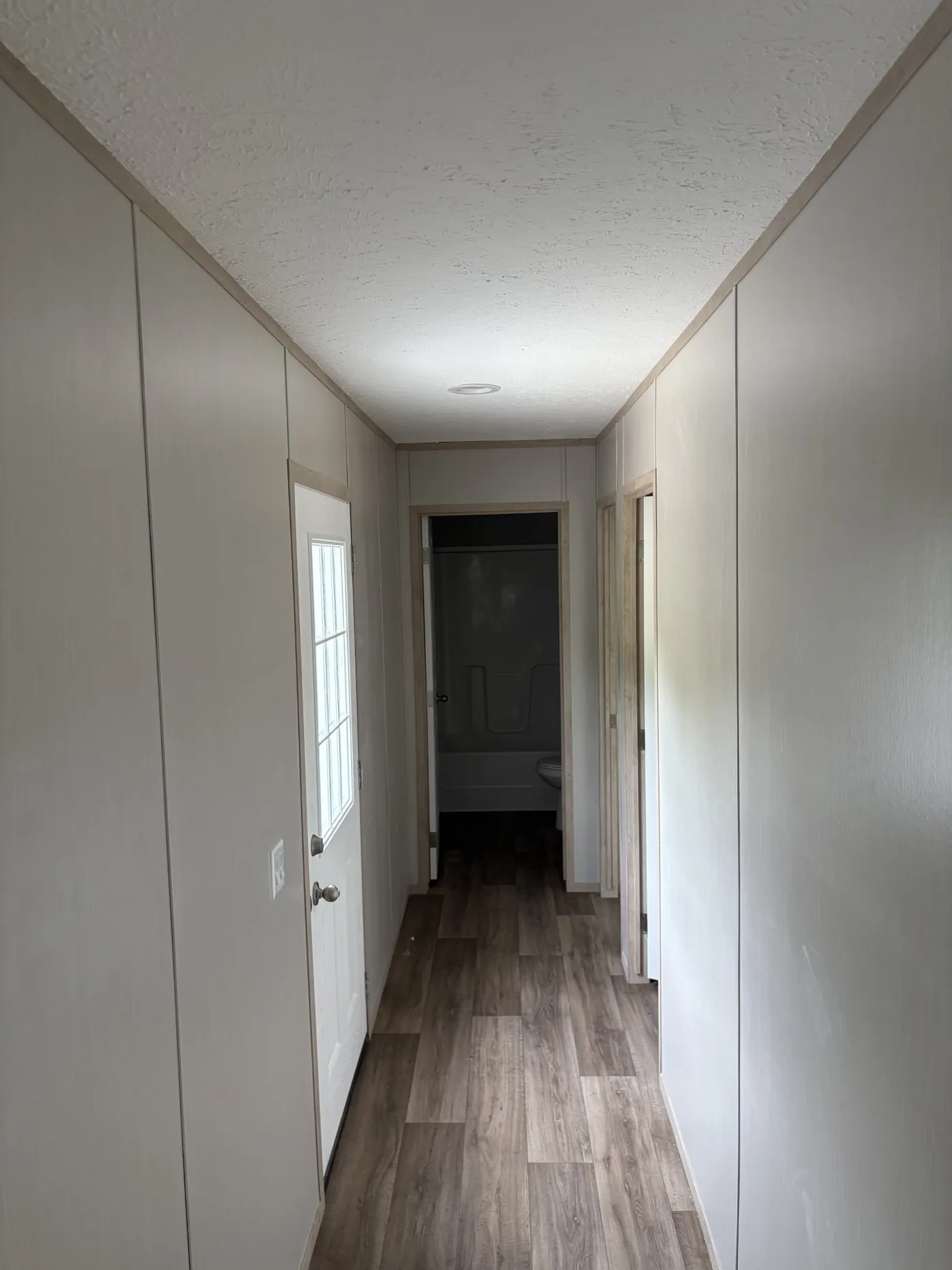 HALLWAY TO THE GUEST BEDROOMS & GUEST BATHROOM
