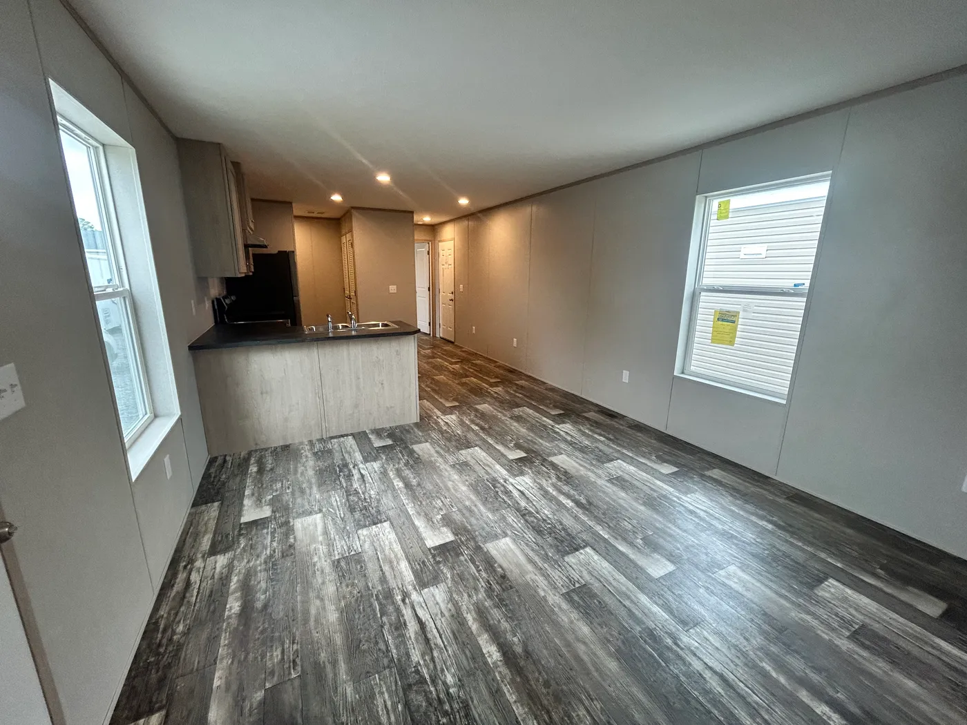 Entry way, looking into the living area and kitchen. Open concept floorplan. 