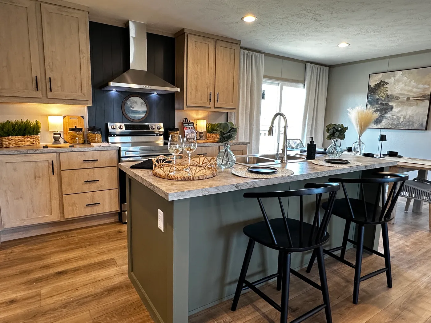 Spacious 3 bedroom, 2 bathroom double wide manufactured home built for comfort and family living. This open layout features both a living room and separate den, perfect for movie nights, entertaining, or creating private space for kids and adults. The modern kitchen includes stainless steel appliances and ample cabinet space. Enjoy year-round comfort with energy-efficient upflow ceiling vents for improved airflow. The private primary suite offers a relaxing retreat with a large soaking tub and s