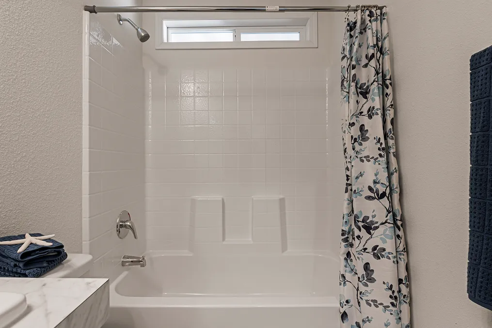 Window over guest bath tub for light and fresh air