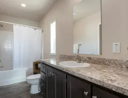 Awesome primary bathroom with porcelain sink.