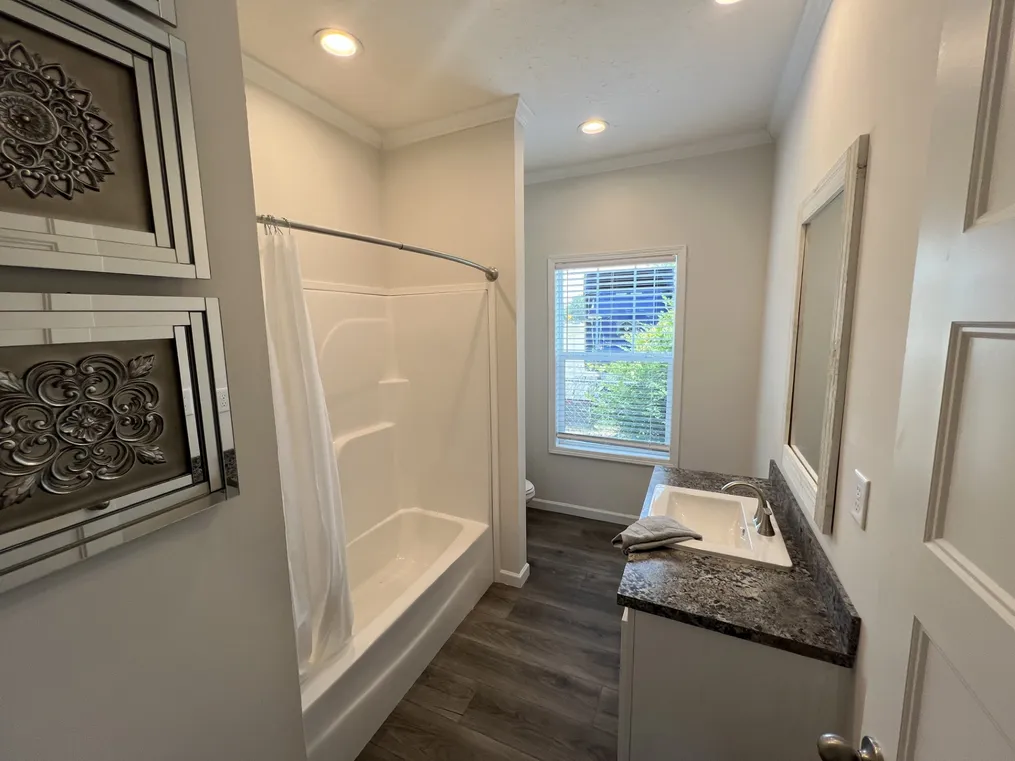 2nd bathroom with fiberglass tub/shower combo. 