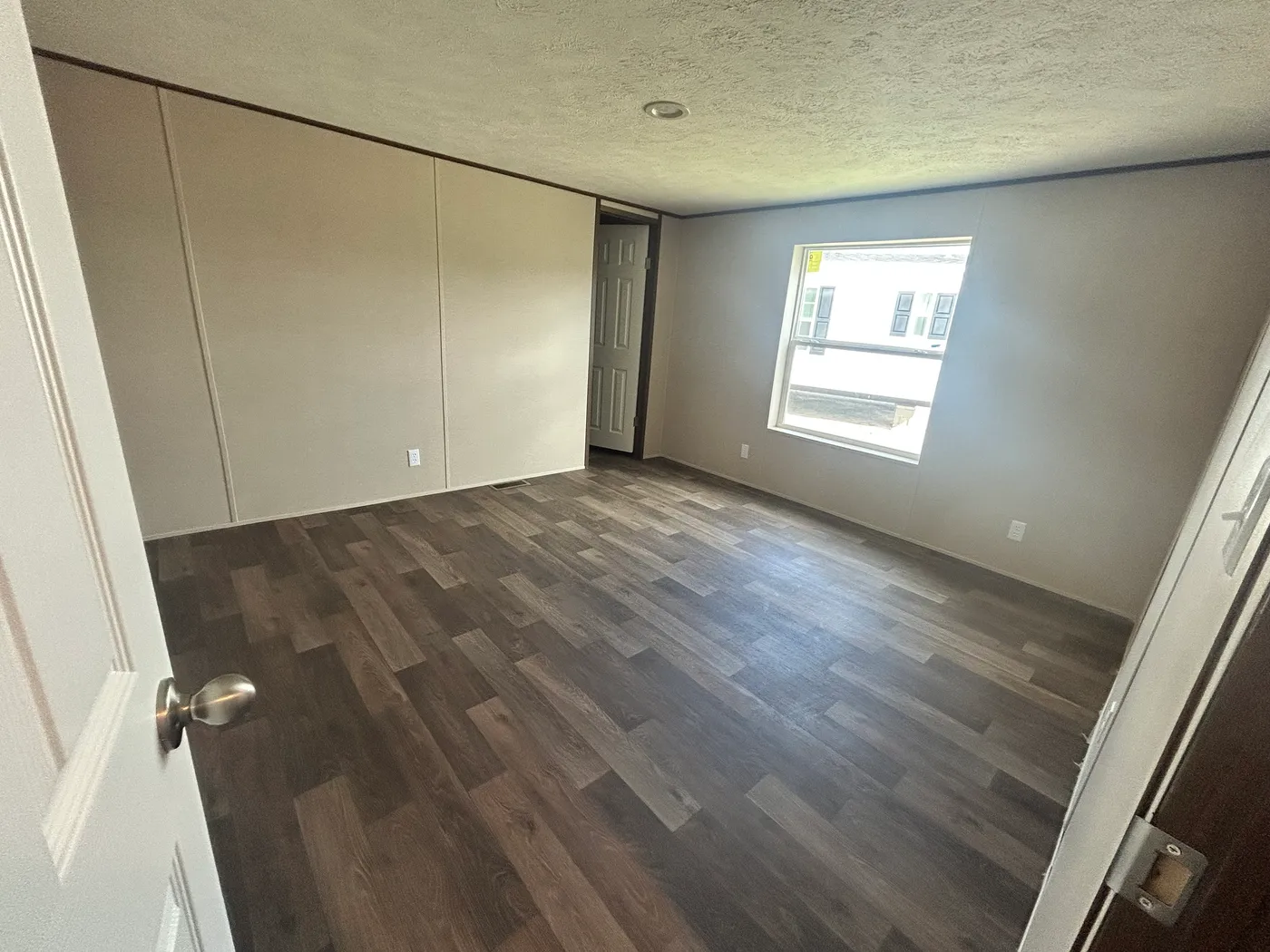 Another look into one of the 4 guest bedrooms. Closet entry shown. 