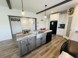 Accent island with deep sink, dishwasher, and additional storage space.