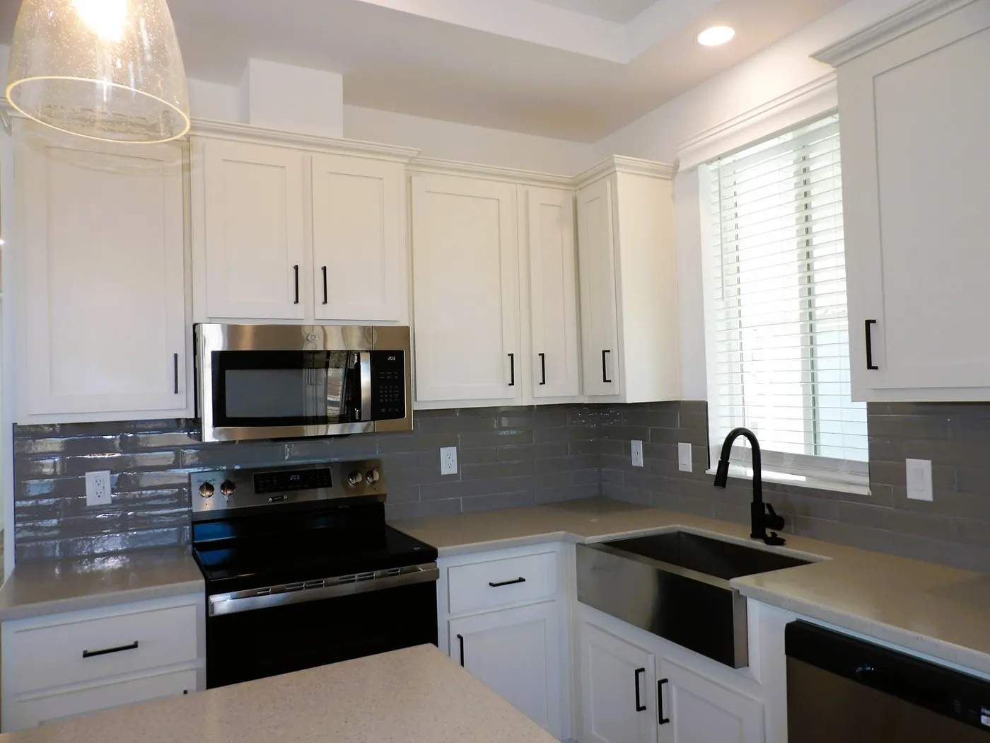 Stainless Steel Farmhouse Sink complements the GE Profile Stainless Steel appliances