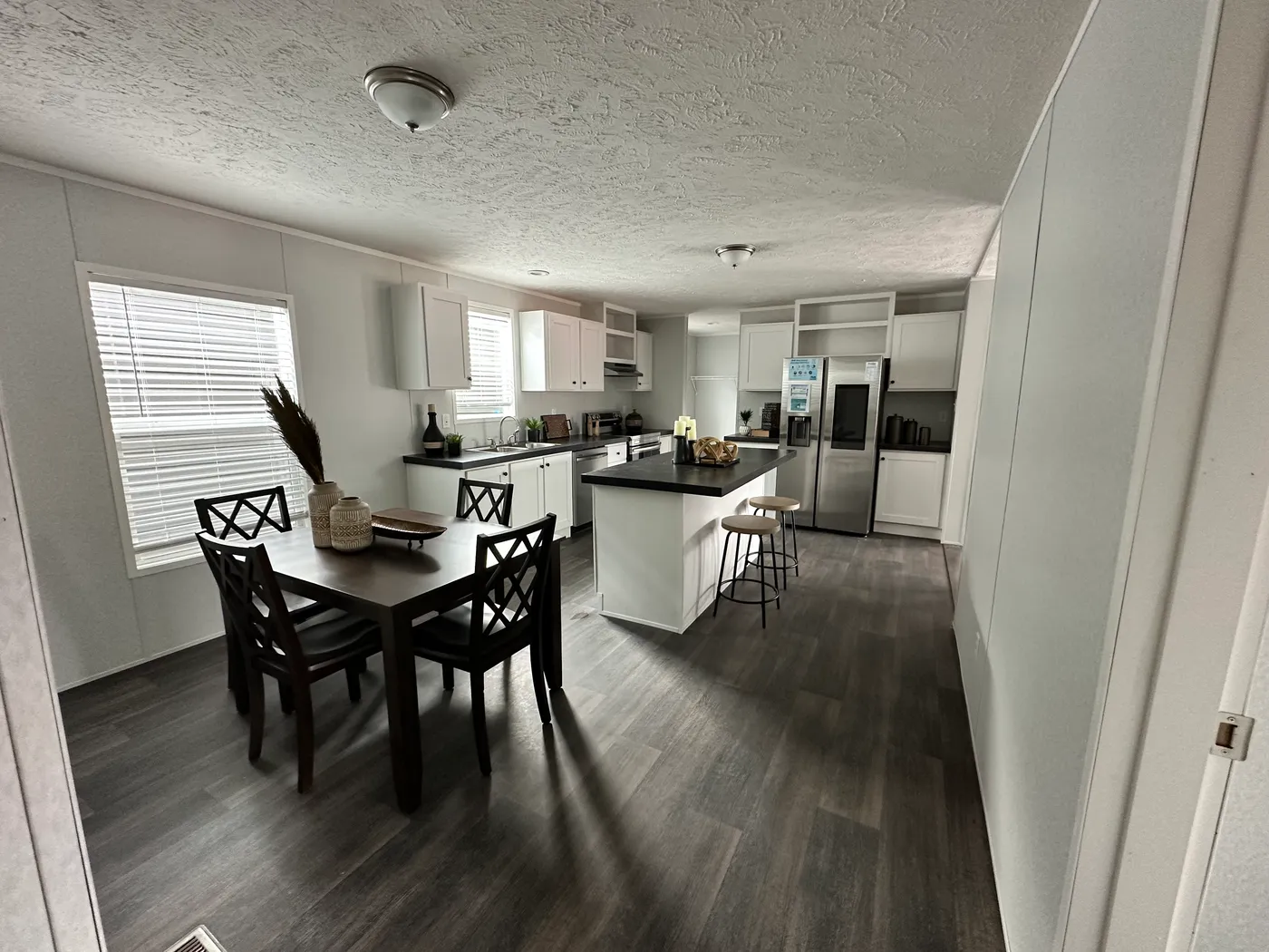 Kitchen view through open dining area.
