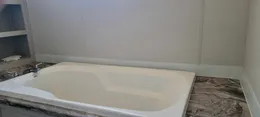 Soaker tub in primary bathroom