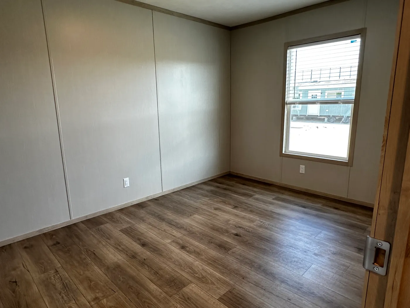 Spacious 3 bedroom, 2 bathroom double wide manufactured home built for comfort and family living. This open layout features both a living room and separate den, perfect for movie nights, entertaining, or creating private space for kids and adults. The modern kitchen includes stainless steel appliances and ample cabinet space. Enjoy year-round comfort with energy-efficient upflow ceiling vents for improved airflow. The private primary suite offers a relaxing retreat with a large soaking tub and s