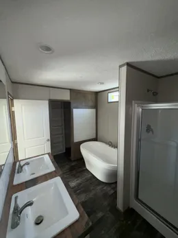 Primary Bathroom Separate Tub and Shower.