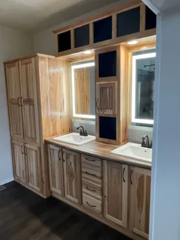 Primary Bathroom vanity with backlit mirrors