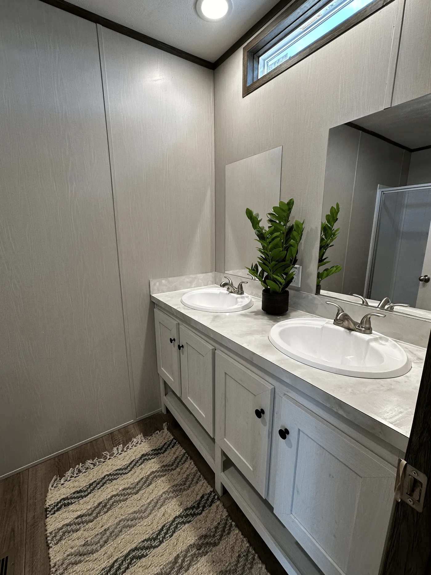 affordable manufactured home, singlewide for sale, stainless steel appliances mobile home, walk-in shower mobile home, walk-in closet primary bedroom, energy-efficient mobile home, natural light mobile home, modern manufactured home, budget-friendly housing, factory-built home for sale.