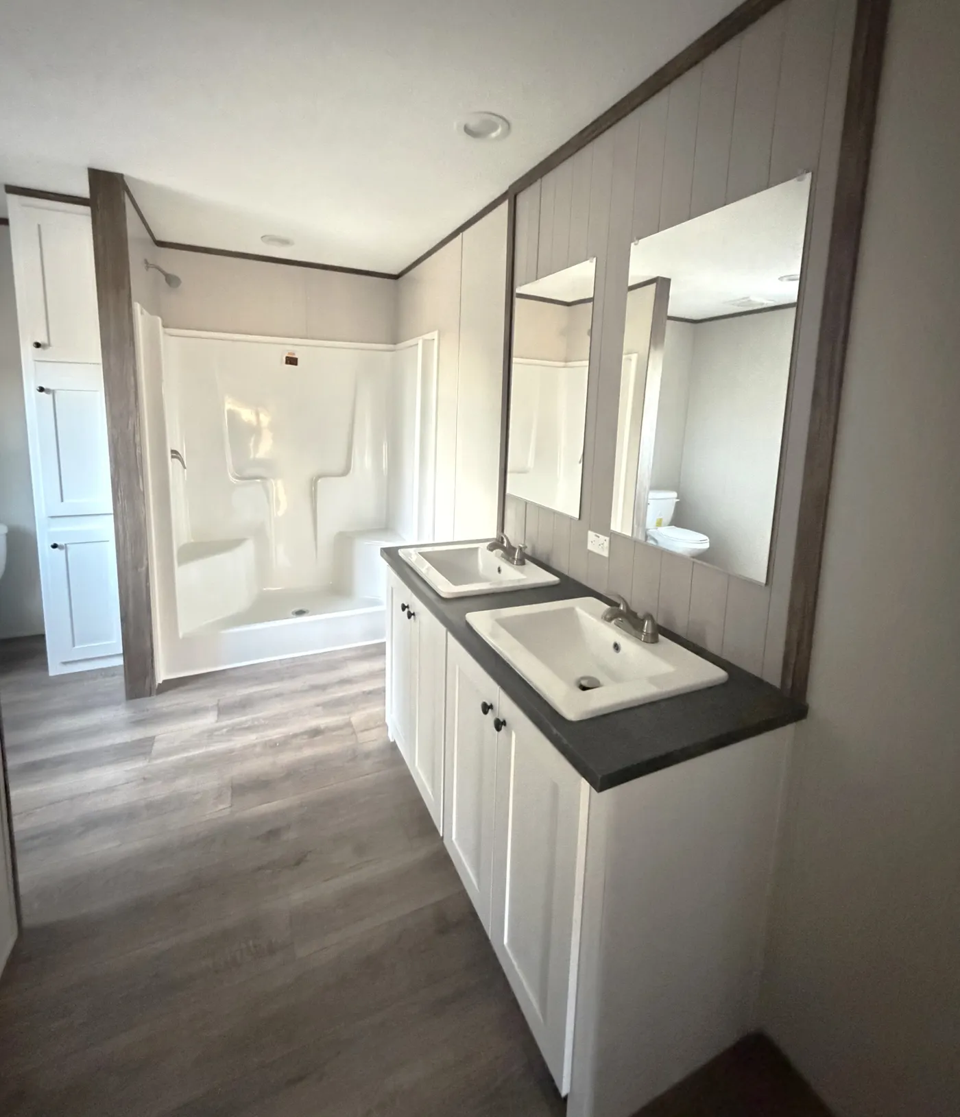 Large walk in closet, double vanity, and 60" shower