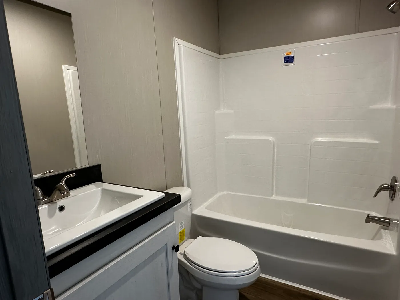 Affordable luxury meets modern comfort in this 3 bedroom, 2 bathroom manufactured home designed for spacious living and energy efficiency. The open-concept layout features a stylish kitchen with stainless steel appliances and a large walk-in pantry for extra storage. The private primary suite includes a generous walk-in closet and a relaxing retreat feel. Enjoy improved comfort with ceiling air vents for better airflow and temperature control throughout the home. This energy-efficient home offer