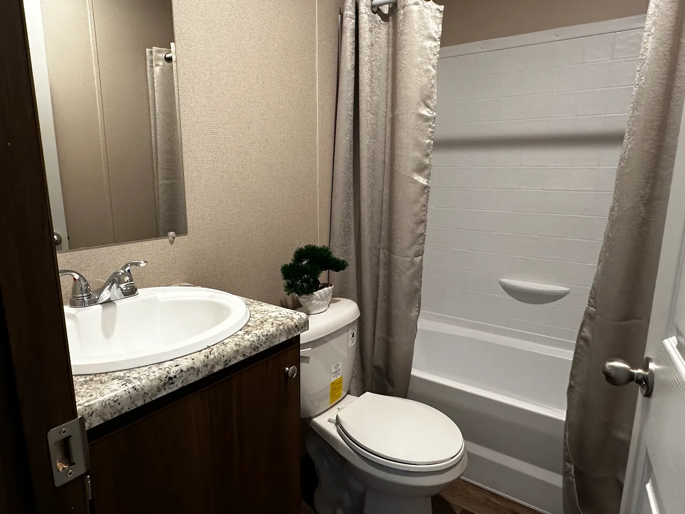 Discover the best value in affordable housing with this spacious 3 bedroom, 2 bath manufactured home, one of the largest and most affordable floor plans available. Designed for comfort and functionality, this energy-efficient mobile home features a large open layout, spacious bedrooms, and modern living areas perfect for families. The kitchen comes fully equipped with a refrigerator, stove, and dishwasher, making move-in easy and convenient. Built for efficiency and long-term savings, this home