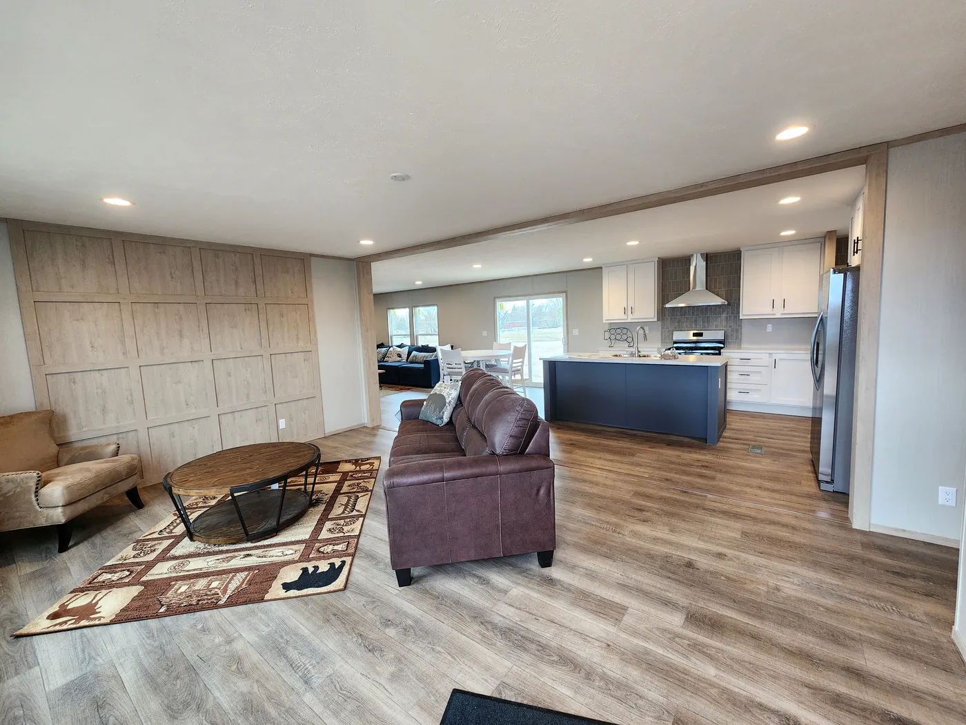 Open concept sitting room with an accent wall