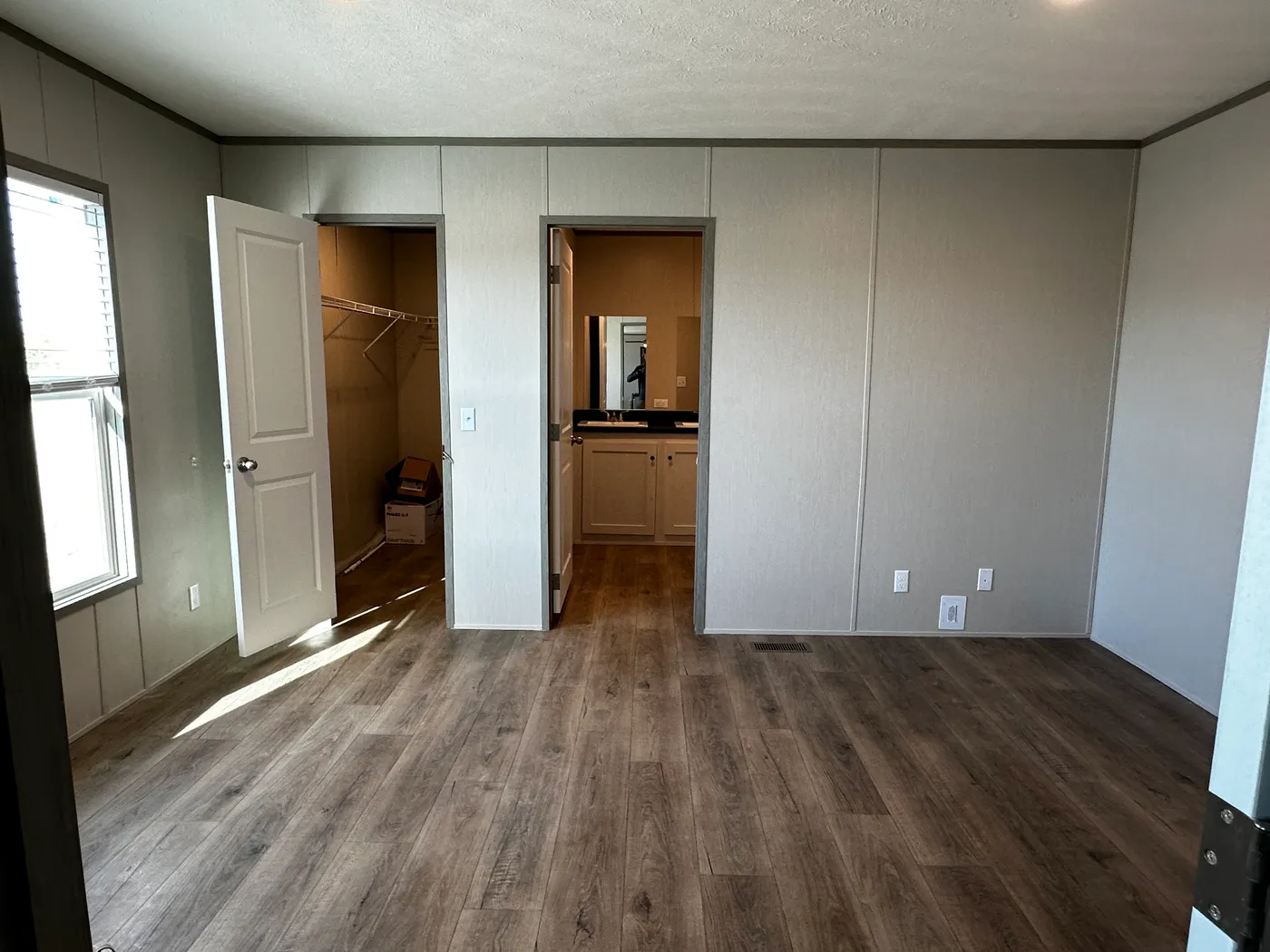 Affordable luxury meets modern comfort in this 3 bedroom, 2 bathroom manufactured home designed for spacious living and energy efficiency. The open-concept layout features a stylish kitchen with stainless steel appliances and a large walk-in pantry for extra storage. The private primary suite includes a generous walk-in closet and a relaxing retreat feel. Enjoy improved comfort with ceiling air vents for better airflow and temperature control throughout the home. This energy-efficient home offer