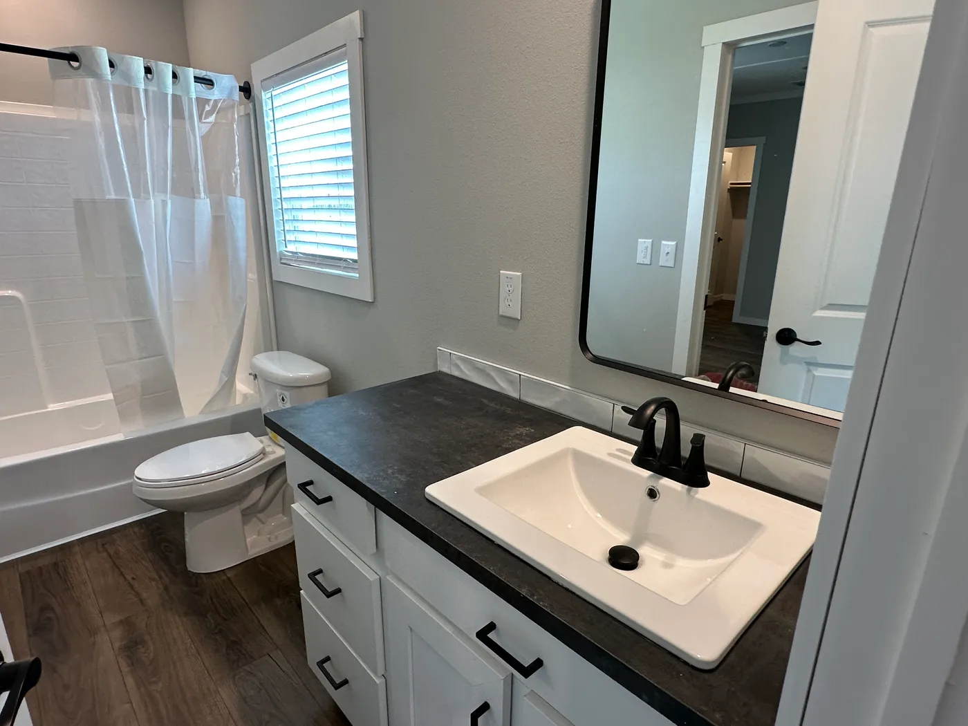 Step inside one of the most beautiful 4 bedroom, 3 bathroom tape and textured doublewide manufactured homes on the market. This stunning home is designed with upscale finishes, open living space, and modern comfort throughout. The spacious living room features vaulted ceilings, elegant crown moulding, and a built-in fireplace that creates a warm, high-end feel the moment you walk in.

The kitchen is loaded with premium features, including quartz countertops, stainless steel appliances, and a s