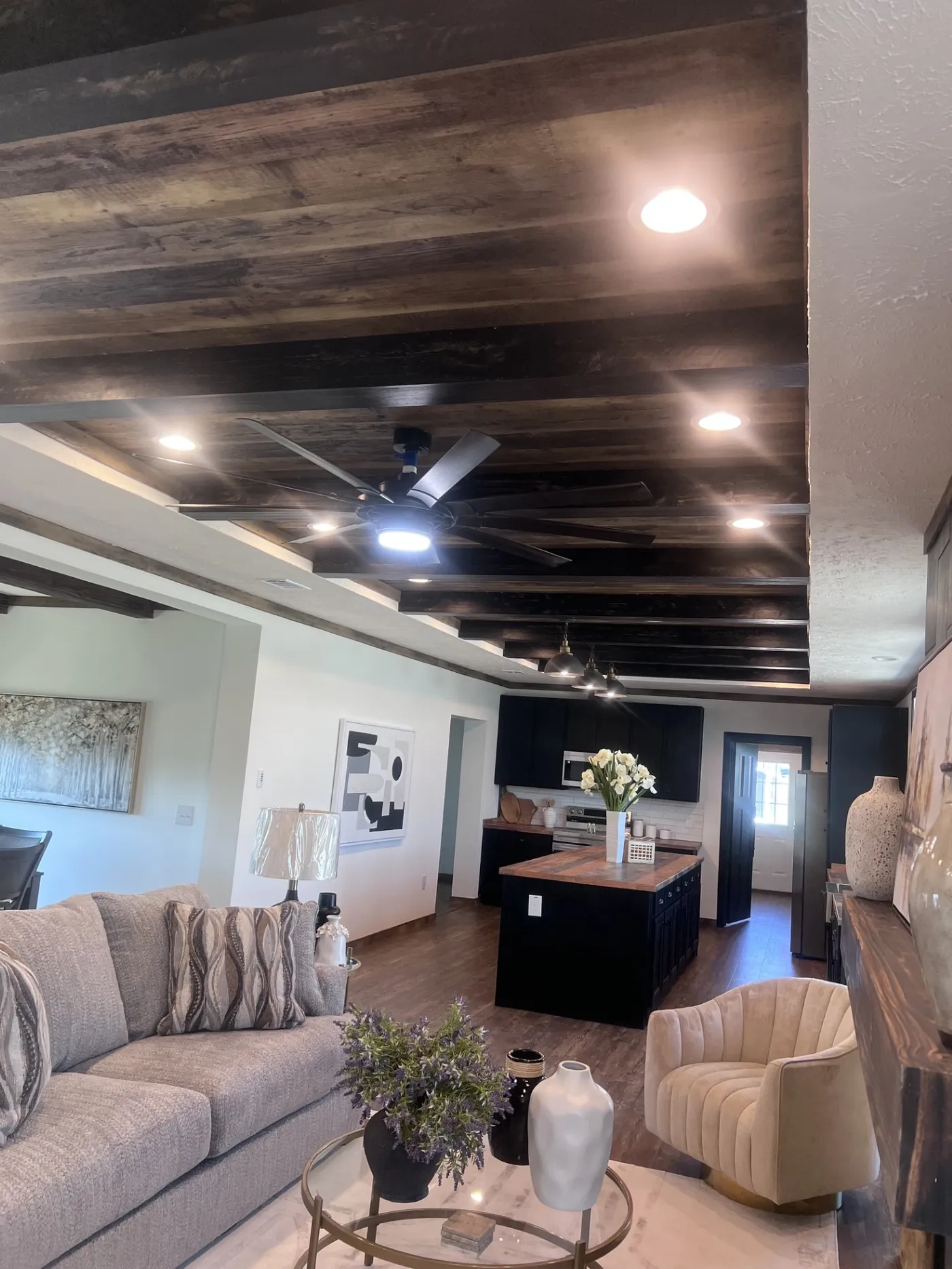 Gorgeous 9ft ceiling with beams running all the way across living room and kitchen! A show stopper