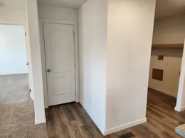 Coat closet off living room and kitchen
