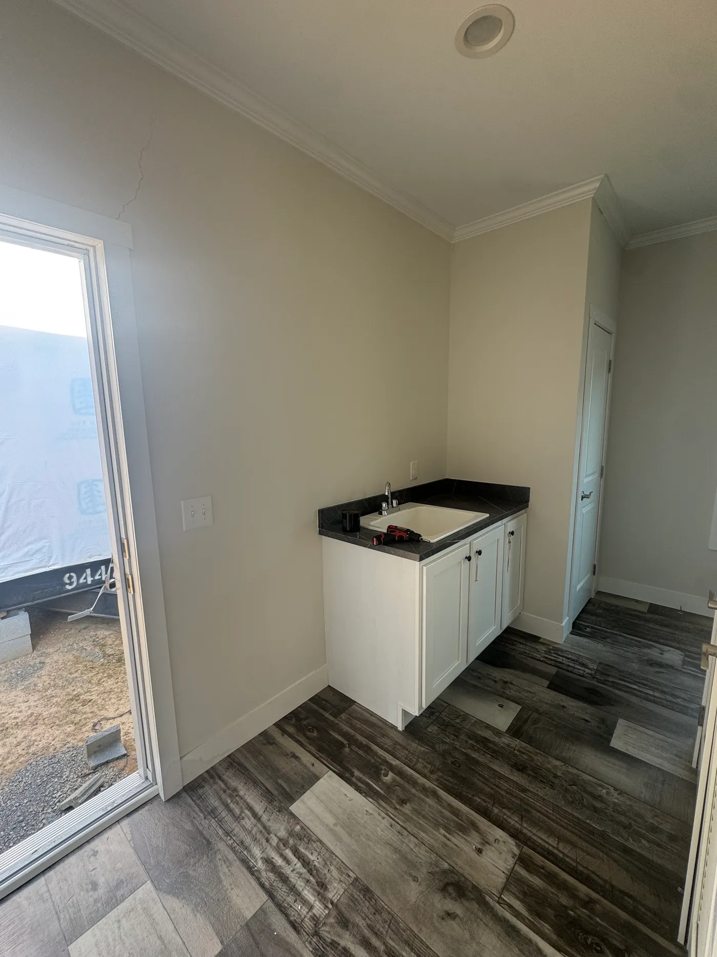 Utility sink and base cabinet. 