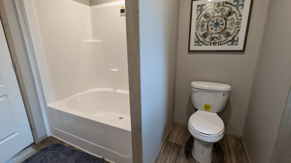 One piece fiberglass tub/shower unit. One piece means no leaks.