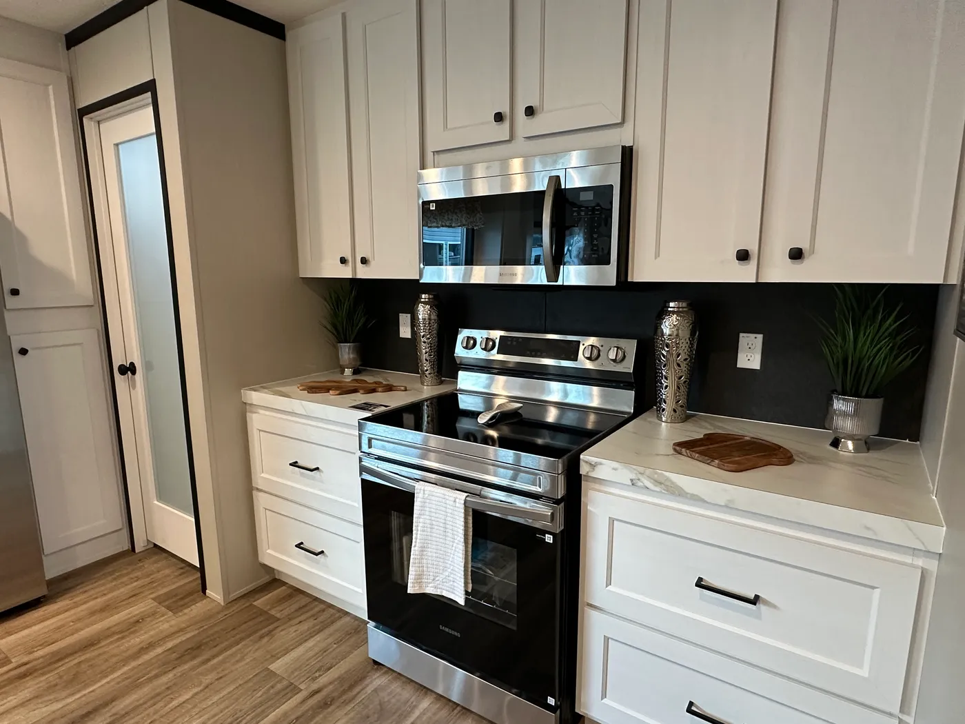 Discover The Heritage, a beautiful 3-bedroom, 2-bath manufactured home offering 1,568 square feet of spacious, functional living at Clayton Homes of Alvin, Texas! This stunning home features a spacious open-concept living room, a modern kitchen with an oversized multifunctional island, and a beautiful built-in fireplace. Enjoy a thoughtfully designed private split-bedroom floor plan, offering comfort and separation for the entire family. The oversized utility and laundry room features a convenie