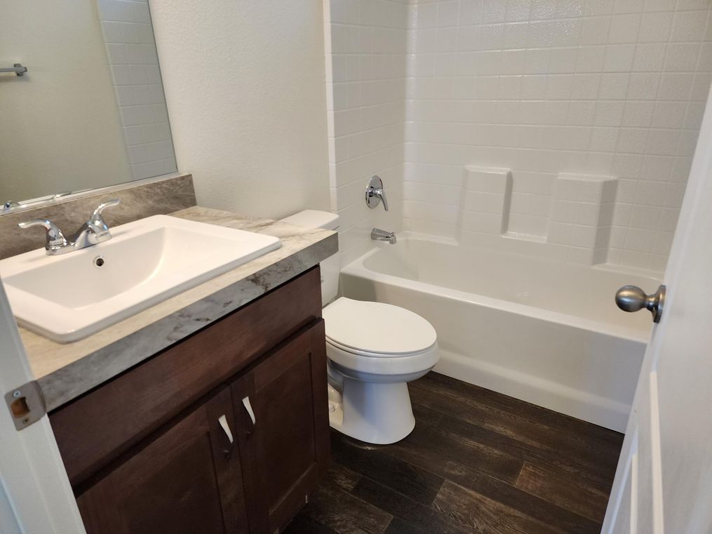Guest bathroom with tub/shower combo.