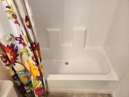 One-piece tub/shower combo.