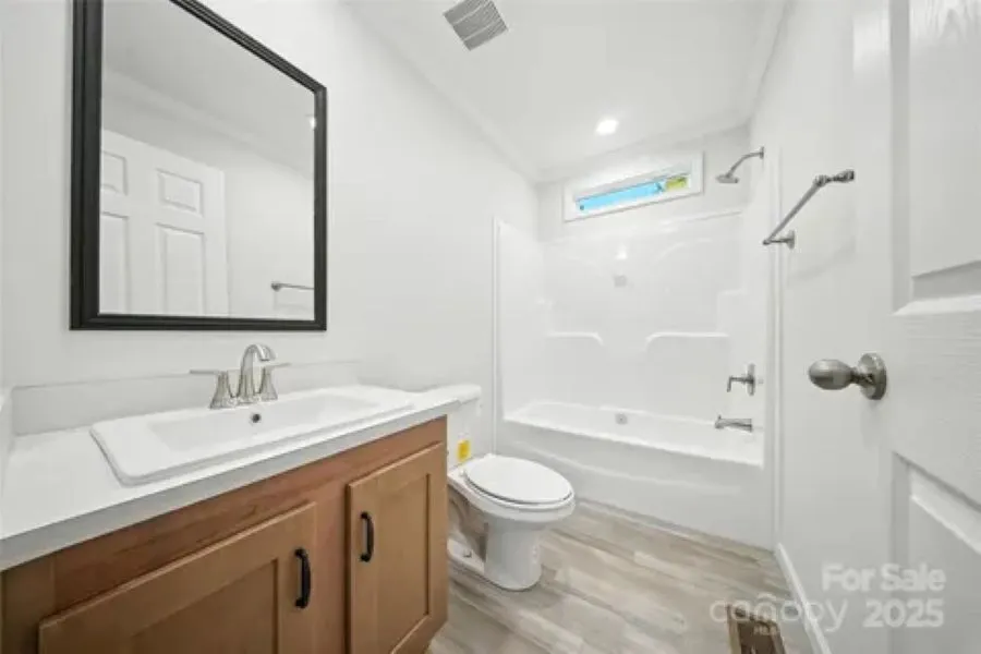 Nice 2nd bathroom with transom to add natural light.  