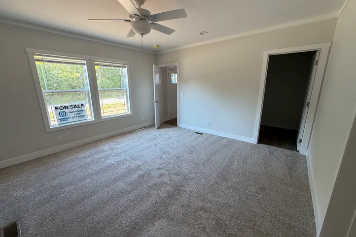 Primary bedroom with walk in closet.