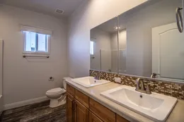 Guest bath with double sinks. 