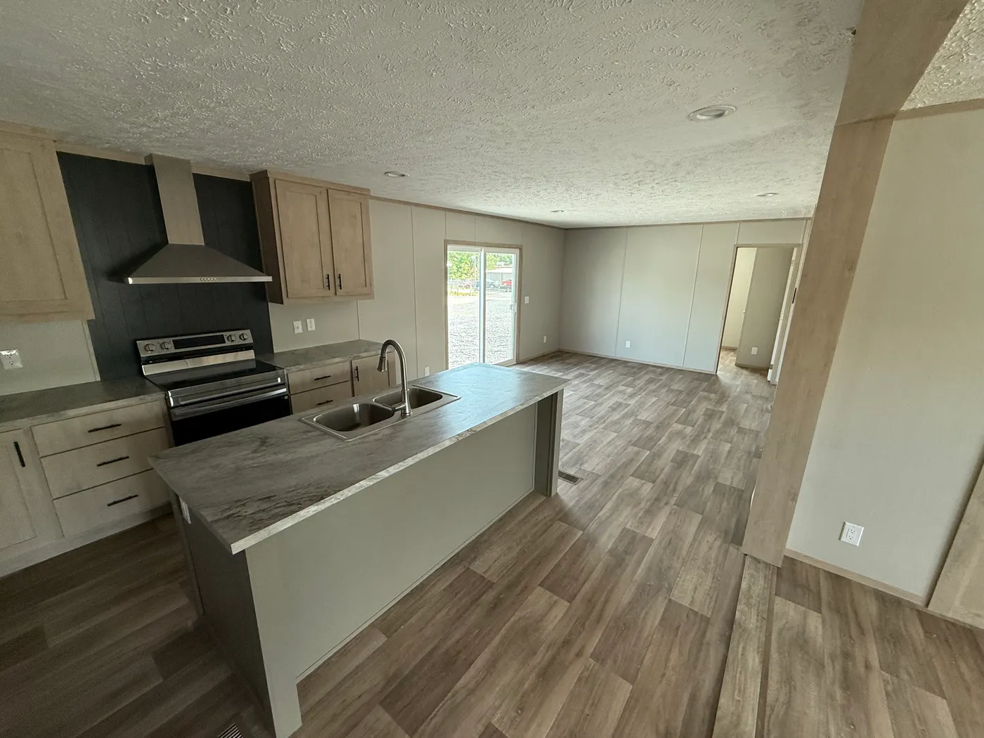 Kitchen looking into the den