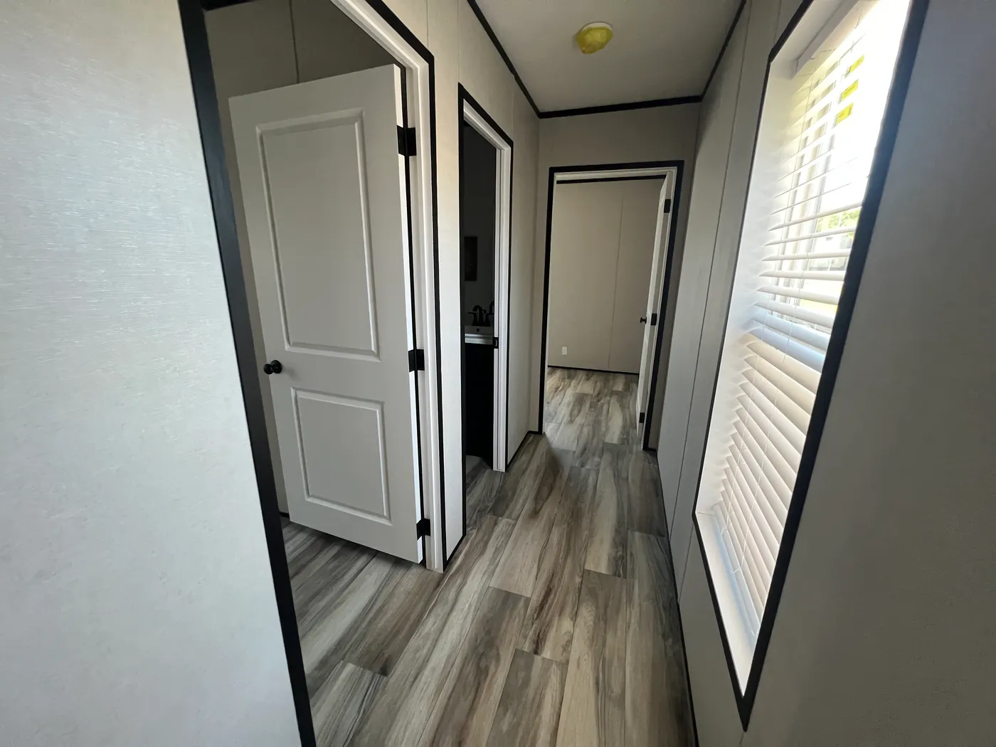 Hallway to secondary bedrooms and bathroom