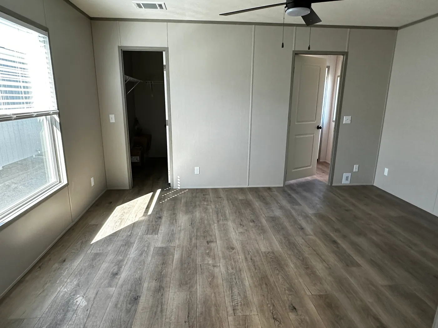 Discover this luxury porch model manufactured home featuring 2 bedrooms, 2 bathrooms, and high-end finishes designed for comfort and style. This modern manufactured home offers an open floor plan, stainless steel appliances, and a huge kitchen island perfect for entertaining. The spacious suite includes a walk-in closet and a large tiled low-profile walk-in shower for a spa-like feel. Built for durability and long-term value, this home features SmartPanel siding with a 50-year warranty, a 25-yea